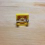 Broche amarillo 2x2 de LEGO®