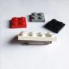 Broche original blanco de LEGO con piezas intercambiables