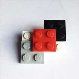Broche original blanco de LEGO con piezas intercambiables
