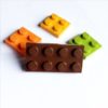 Broche original marrón de LEGO con piezas intercambiables